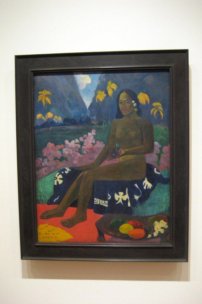 Figurative painting of two women seated on a blanket against a dark backdrop